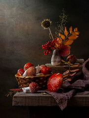 Rustic still life with fly agaric and autumn leaves on a dark background