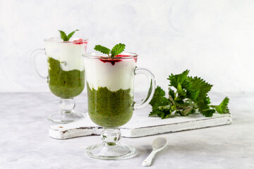 Delicious dessert with a layer of yogurt, nettle smoothie and honeysuckle jam. Dessert is served in...