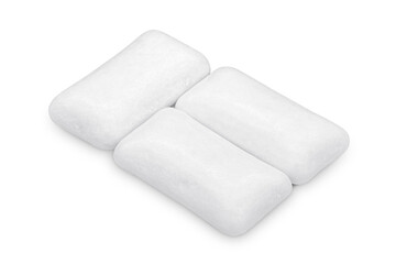 Three pieces of white chewing gum isolated on white. The whole subject is in focus.