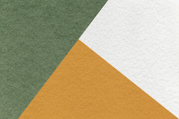 Texture of craft white, olive and orange shade color paper background, macro. Vintage abstract...