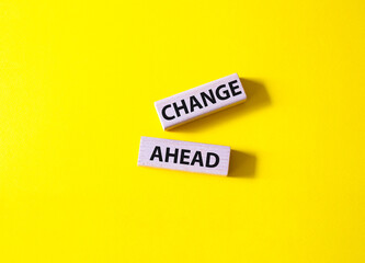 Change ahead symbol. Wooden blocks with words Change ahead. Beautiful yellow background. Business...