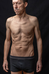 Obraz premium Paris, France - 01 09 2023: still life. Studio shot of a mature man posing shirtless