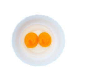 Egg with two yolks in white plate isolated on transparent background png file