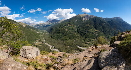 Fototapeta na wymiar Panoramic view of the Drac Valley forests in the Champsaur from La Coche Plateau. Ecrins National Park, Hautes-Alpes, France