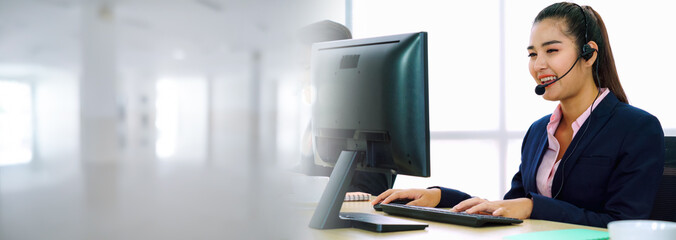 Business people wearing headset working in office in widen view to support remote customer or...