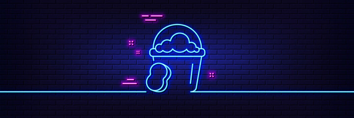 Neon light glow effect. Cleaning bucket with sponge line icon. Washing Housekeeping equipment sign. 3d line neon glow icon. Brick wall banner. Sponge outline. Vector © blankstock