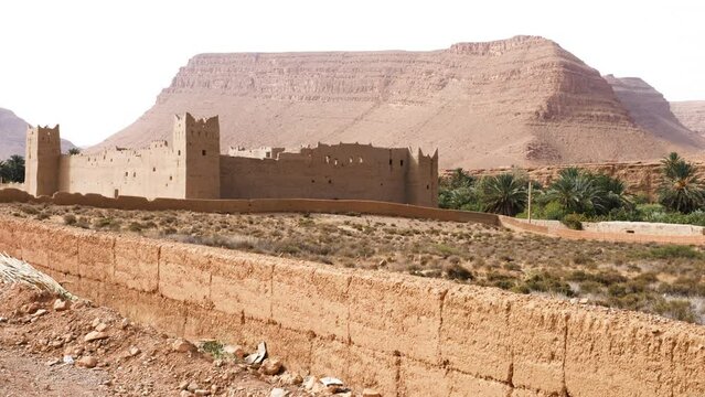View of a rural village (Ksar, Kasbah, Casbah) in the Ziz Valley in Morocco. Authentic traditional Moroccan country-style architecture. 4k footage.  