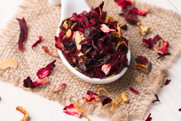 Dry red floral fruit and herbal hibiscus tea with petals 