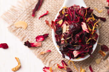 Dry red floral fruit and herbal hibiscus tea with petals 