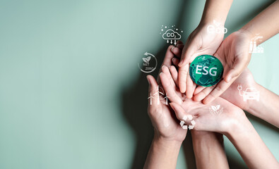 Fototapeta na wymiar Hands together holding ESG Environmental, environmental, social, and governance in sustainable and ethical business on the Network connection.