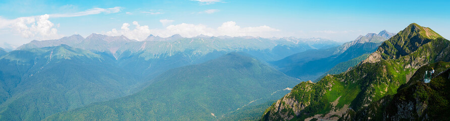 Panorama: View from the top of Roza Peak to the Caucasian mountains in summer on a sunny day © Shauerman