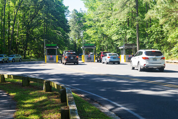 line of cars at the gate to the Chincoteague Island Natural Park Conservation Area, Virginia.
