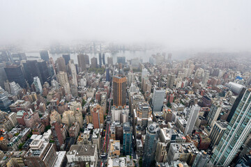 New York, Manhattan, October 1, 2022: The cloudy view of Midtown Manhattan, the East River and...