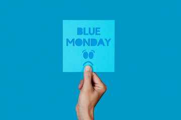Fototapeta sign with the text blue monday and a sad face obraz