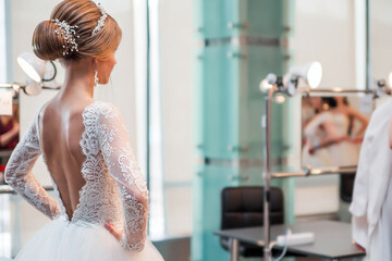 Competition among wedding stylists. A model in a wedding dress, with hair and make-up shows the...
