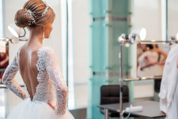 Competition among wedding stylists. A model in a wedding dress, with hair and make-up shows the result of the stylist's work. © ribalka yuli