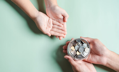 hands of adult and child holding money jar, donation, saving, fundraising charity, family finance...
