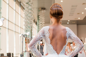 Competition among wedding stylists. A model in a wedding dress, with hair and make-up shows the result of the stylist's work. © ribalka yuli