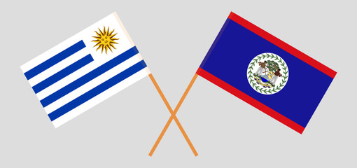 Crossed flags of Uruguay and Belize. Official colors. Correct proportion