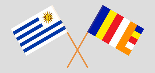 Crossed flags of Uruguay and Buddhism. Official colors. Correct proportion