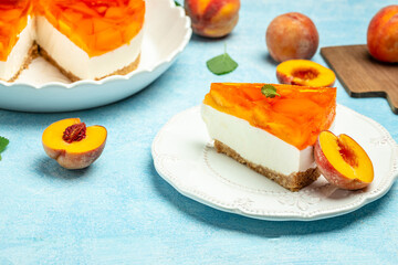 dessert peaches, cheesecake with peache jelly on white plate. Restaurant menu, dieting, cookbook recipe top view