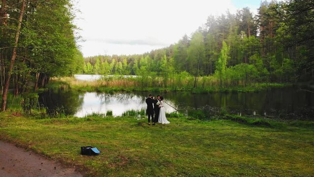 Aerial view caucasian wedding couple on photo shoot outdoors in scenic Lithuania nature