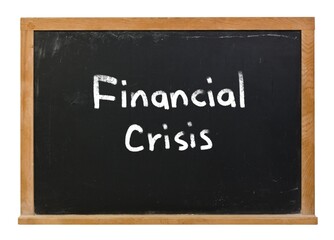 Obraz premium Financial crisis written in white chalk on a black chalkboard isolated on white