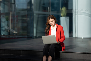Asian business woman with computer laptop pc in office district.