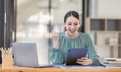 Excited Canada American woman sit at desk feel euphoric win online lottery, happy black woman overjoyed get mail at tablet being promoted at work, biracial girl amazed read good news at computer
