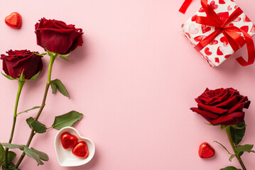 Valentine's Day concept. Top view photo of red roses heart shaped saucer with candies and giftbox...