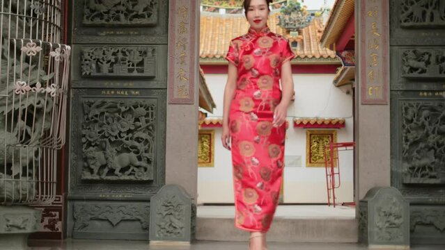 woman in clothing. woman in red dress in the temple.woman in red dress