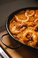 A homemade Spanish paella in an iron pan