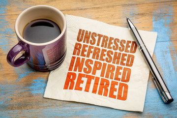 unstressed, refreshed, inspired, retired - retirement cheerful concept on a napkin