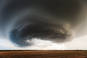 Dark storm clouds over a field