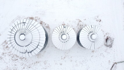 Snow capped farm silos © Matt