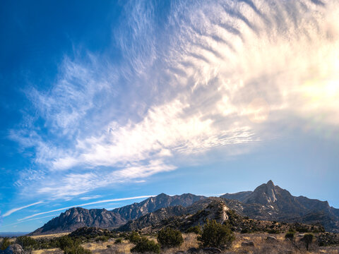 Organ Mountains-Desert Peaks National Monument cloudscape with sunrays in Las Cruces, Doña Ana County, New Mexico, Southwestern USA, dramatic cloudscape over the Sugarloaf Peak area.