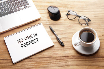 No One Is Perfect, motivational words and sentences for work and life. Quote sentence in notebook with laptop, pen, coffee over wooden background.