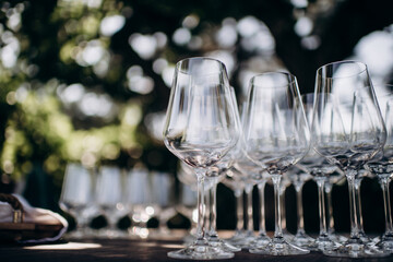 many empty clean shiny elegant glasses for alcohol