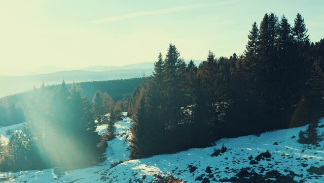 Aerial shot of the mountains of South Tyrol at sunset. 4k footage from Renon cable car, Soprabolzano, Corno del Renon. Breathtaking views of winter landscape and early melting of snow.