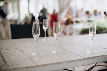 empty glasses and glass of wine on a black background