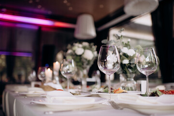 beautiful wedding table setting with white wine and glasses