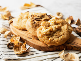White chocolate cookies and chocolate cookies on a cutting board