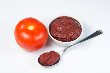 Tomato paste and tomato on white background