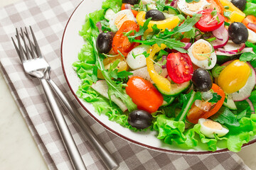 Vegetable salad , with quail eggs and olives, fresh, close-up, no people,