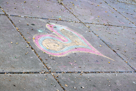 Distorted Rainbow Heart on a Street Grey Concrete Slab
