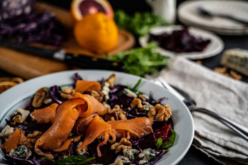 Smoked salmon tops a winter salad loaded with seasonal 
