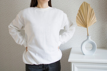 White sweatshirt mockup with palm leaf. Female wear plain
