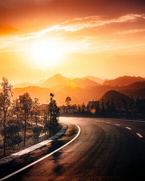 View of a road crossing a mountain with forest near Luoping, Yunnan province, China.