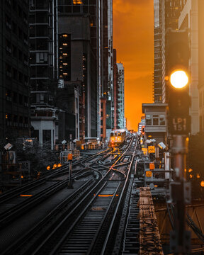 View of the city subway crossing Chicago downtown at sunset, Illinois, United States.