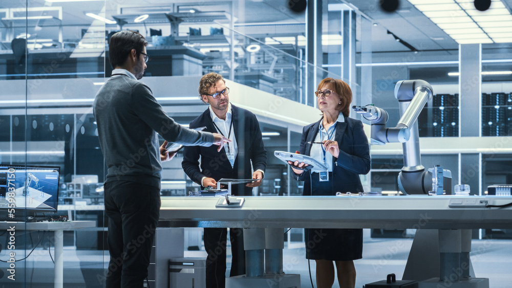 Aufkleber Professional Multicultural Team of Female and Male Engineers Using Industrial Programmable Robotic Arm in a Factory Development Facility. Tech Facility with Machines, Computers and Research Equipment.